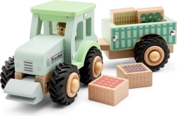 Koka traktors ar piekabi un kravu