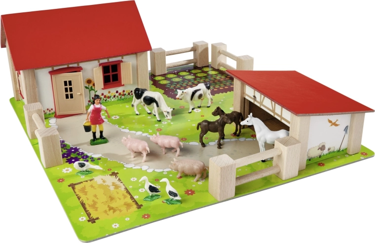 Stabilas koka ēkas ar sarkanu jumtu