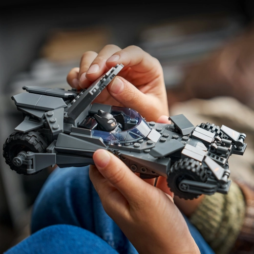 Batman in armor behind the wheel