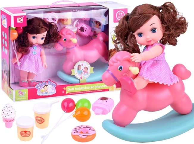 Doll in pink polka dot dress with rocking horse and accessories