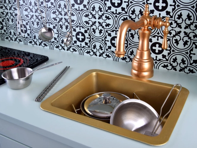 Stylish gold sink and vintage faucet