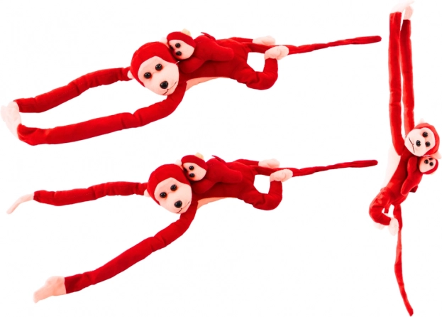 Plush red monkey with baby