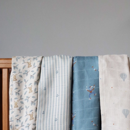 Multifunctional swaddle for home and travel