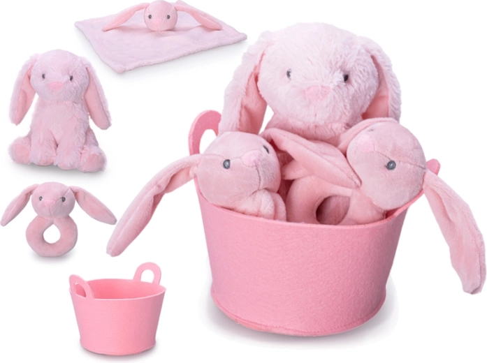 Gift set for baby with pink plush bunny, rattle and comforter in a basket