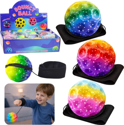 Sensorā bumbiņa uz gumijas auklas ar aproci, varavīksnes, 6 cm