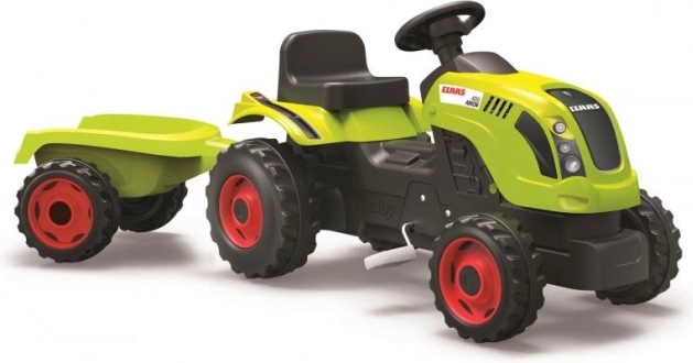 Pedāļu traktors CLAAS ar zaļu piekabi