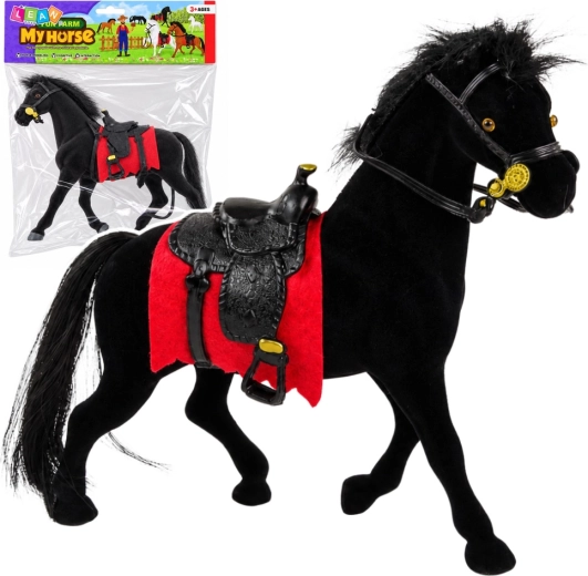 Velvet figurine of a black horse with a red saddle pad and saddle