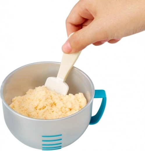 Mērglāze ar iedaļām un lāpstiņa precīzai maisīšanai