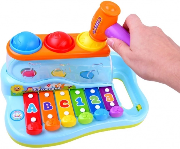 Interactive toy with balls and hammer