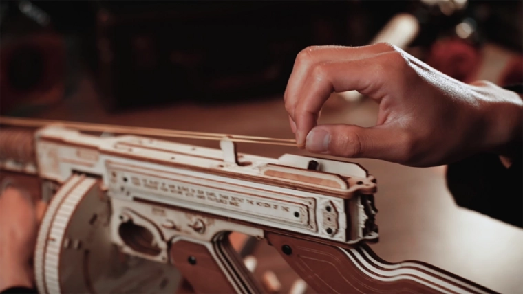 Functional rubber band mechanism with two modes